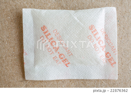 Close up silica gel or desiccant in paper bag Close up silica gel or desiccant in paper bag 22876362