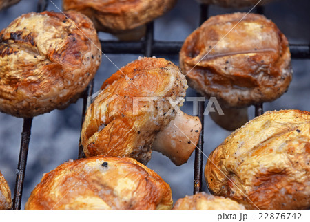 White champignons mushrooms on grill 22876742