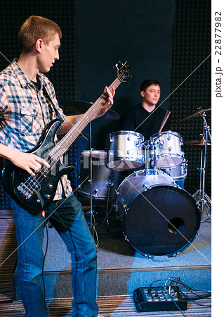 Bass guitar player and drummer play music 22877982