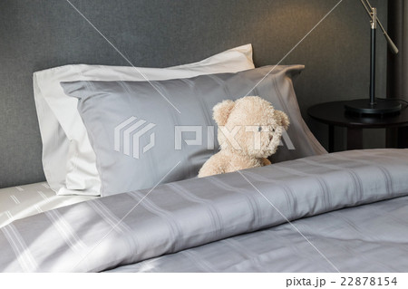 kids room with doll bear and pillows on bed 22878154