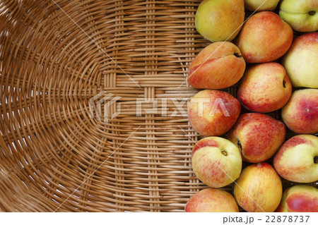 Ripe peaches in basket 22878737