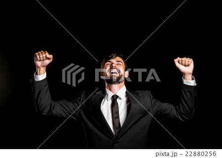 Handsome businessman on black background 22880256