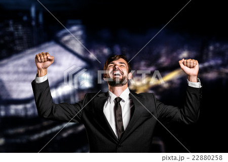 Businessman on night cityscape background Businessman on night cityscape background 22880258