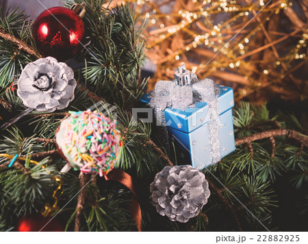 Blue spruce tree branches with Christmas baubles 22882925