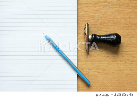 Paper note with blue pen and rubber stamp Paper note with blue pen and rubber stamp 22885548