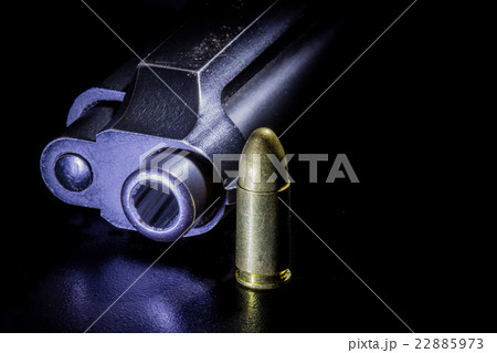 Gun and bullets 22885973
