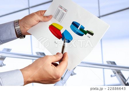 Businessman standing and showing graphics, diagram 22886643