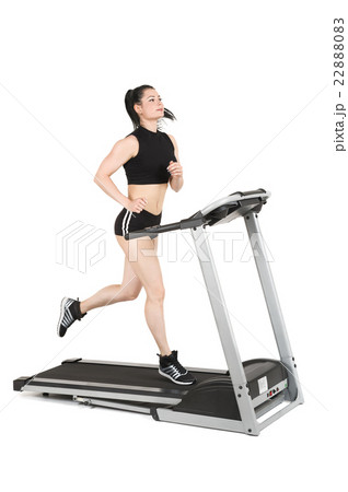 young woman running on treadmill 22888083