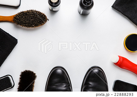 Cleaning boots concept on white background Cleaning boots concept on white background 22888293