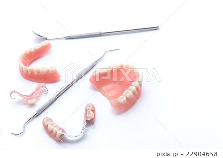 Set of dentures and dental tools on white  22904658