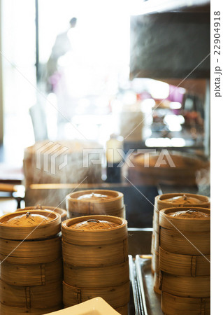 Dumplings cooking inside bamboo steamers 22904918