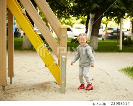 girl playing at the playground girl playing at the playground 22908514