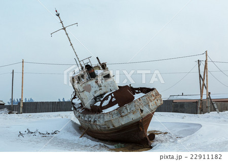 Old rusty ship on winter shore of Lake Baikal. Old rusty ship on winter shore of Lake Baikal. 22911182