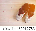 Old dirty football shoes on the wooden table 22912733
