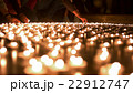 People Firing Up and Placing Candles to Other Ones 22912747