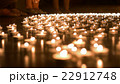 One Person Placing Candle to the Group of Candles 22912748