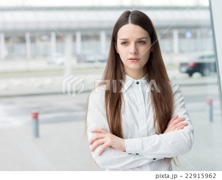 Confident business woman standing in office Confident business woman standing in office 22915962