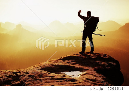 Tourist with backpack, hand shadowing eyes. Tourist with backpack, hand shadowing eyes. 22916114