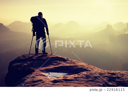 Hiker with broken leg in immobilizer. Deep valley Hiker with broken leg in immobilizer. Deep valley 22916115