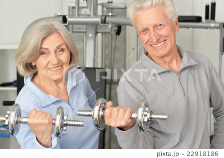 senior couple exercising in gym 22918186
