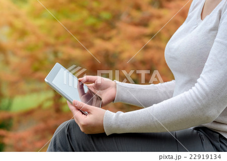 Woman with tablet PC in her hands 22919134