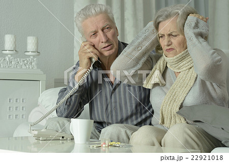 sick elderly couple with phone sick elderly couple with phone 22921018