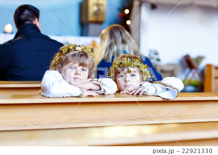 Two little boys playing an angel of Christmas 22921330