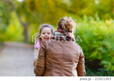 mother and her little daughter at beautiful autumn mother and her little daughter at beautiful autumn 22921363