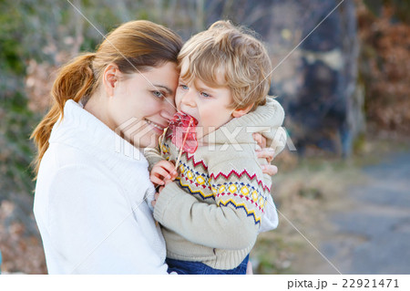 Mother and little kid boy in park or forest 22921471
