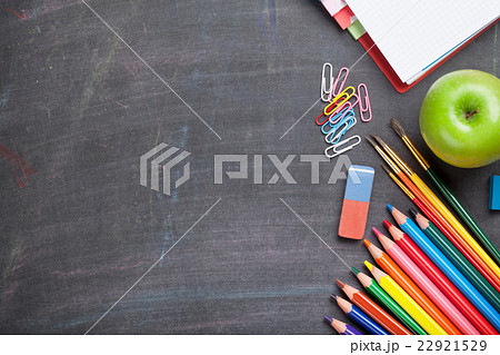 School supplies on blackboard background School supplies on blackboard background 22921529
