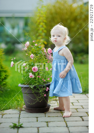 Adorable girl portrait outdoors 22921729