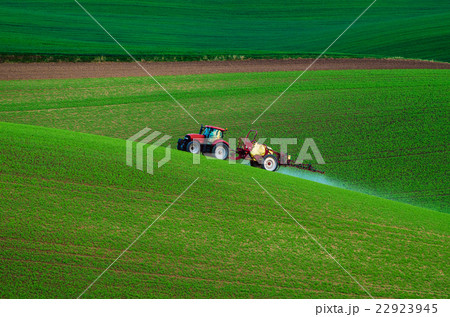 Farm machinery spraying insecticide 22923945