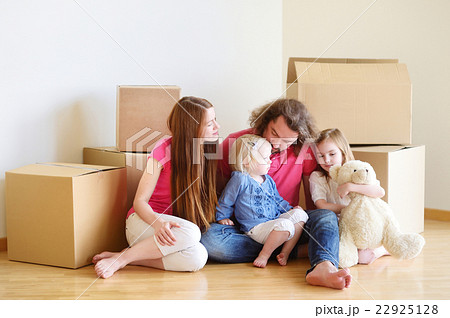 Happy young family in their new home Happy young family in their new home 22925128