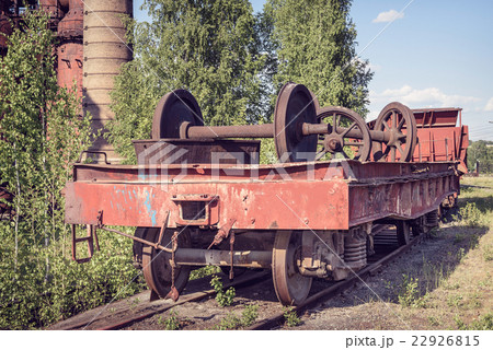 Old flat wagon with railcar wheelset 22926815