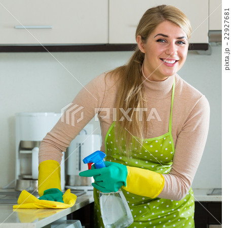 Housewife cleaning in home kitchen. 22927681
