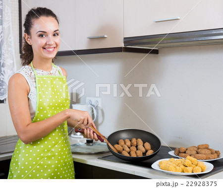 woman frying filled croquettes 22928375