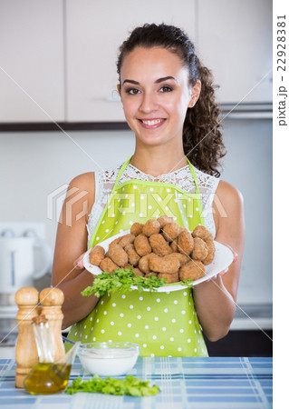 woman posing with plate of deep-fried kroketten 22928381