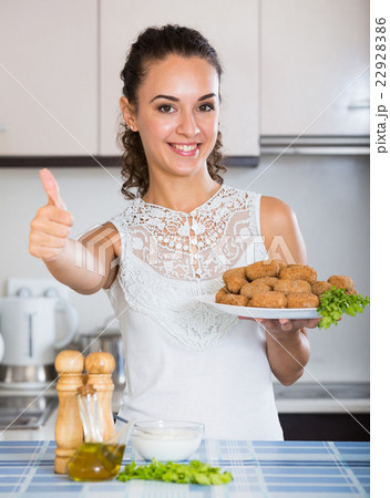 girl with tasty breadcrumbed crocchette girl with tasty breadcrumbed crocchette 22928386