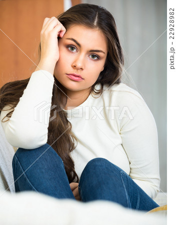 Upset adult girl at home. 22928982