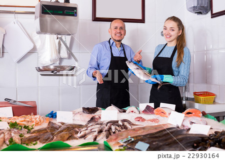 girl and man posing near display girl and man posing near display 22930164