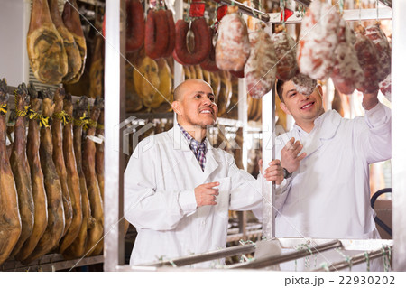 Technologist with butcher checking jamon Technologist with butcher checking jamon 22930202