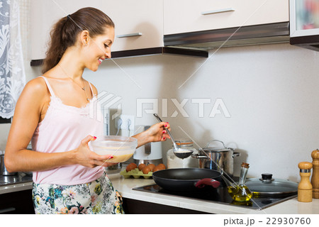 Woman cooking egg souffle Woman cooking egg souffle 22930760