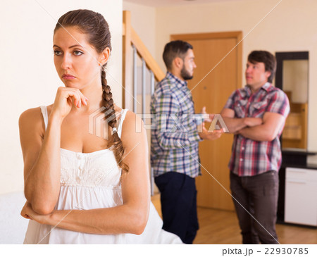 Unhappy woman with men having troubles Unhappy woman with men having troubles 22930785