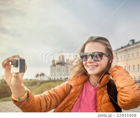 young woman traveler with a camera in hand. 22931808