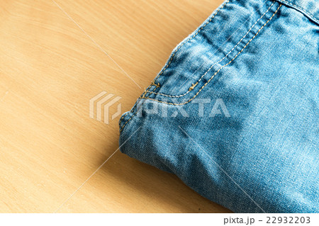 Jeans on a wooden background 22932203