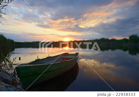 fisherman boat at sunset fisherman boat at sunset 22938333