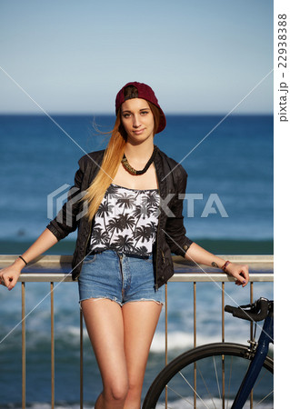 Hipster girl standing with her sport fixed bike 22938388