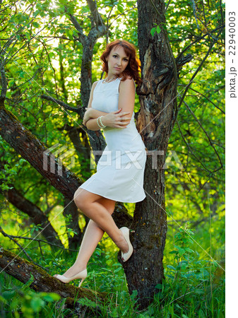 Free Happy Woman with Gorgeous Red Hair Enjoying 22940003