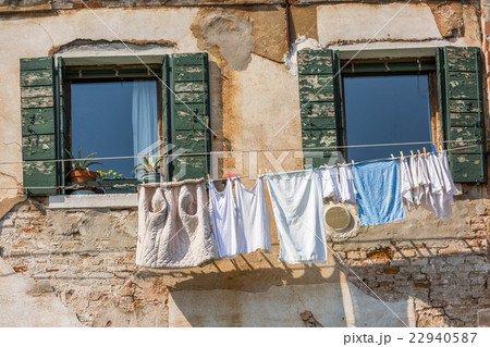 Venetian windows with the laundry drying on a wire 22940587