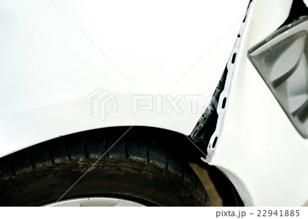 Dented and opening wound on a damaged white car Dented and opening wound on a damaged white car 22941885